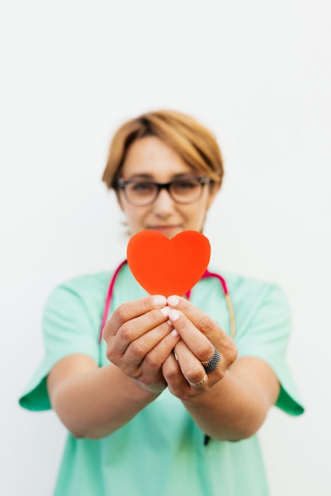 Doctor Holding Heart in Hands