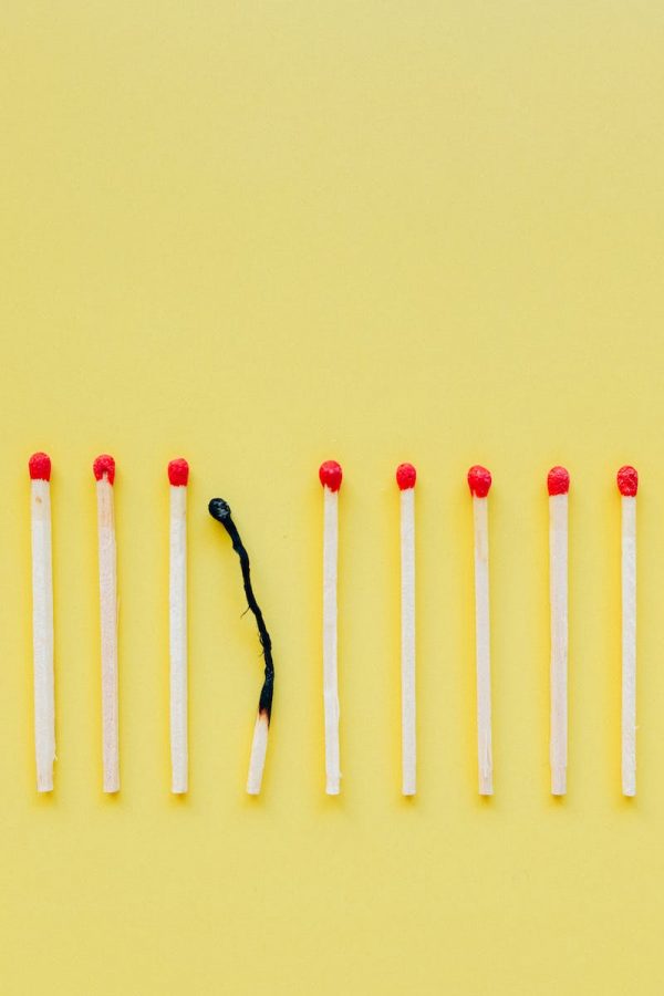 White and Red Candles on White Surface
